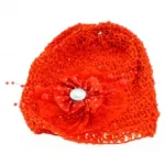 Bonnet bébé orné d’une fleur à pois et perles