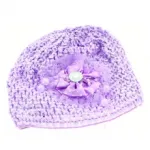 Bonnet bébé orné d’une fleur à pois et perles