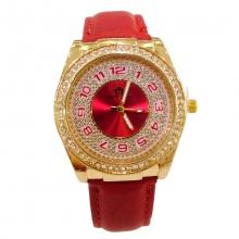 Montre-bracelet dorée pour femme agrémentée de strass